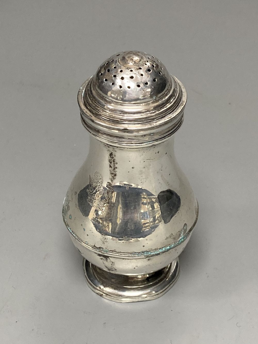 A George II silver baluster pepperette, by John Gamon, circa 1730, 10.9cm, 96 grams.